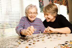 memory care resident working on a puzzle