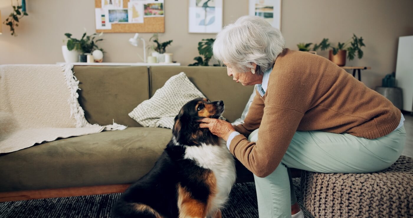 resident with dog at pet-friendly assisted living community