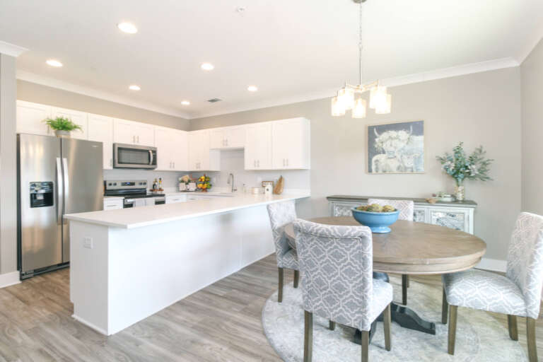 Two Bedroom senior living apartment with kitchen and dining area at The Landing of Winder