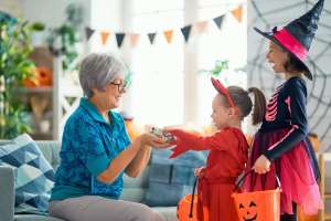 Halloween sundowning dementia older adult giving out candy